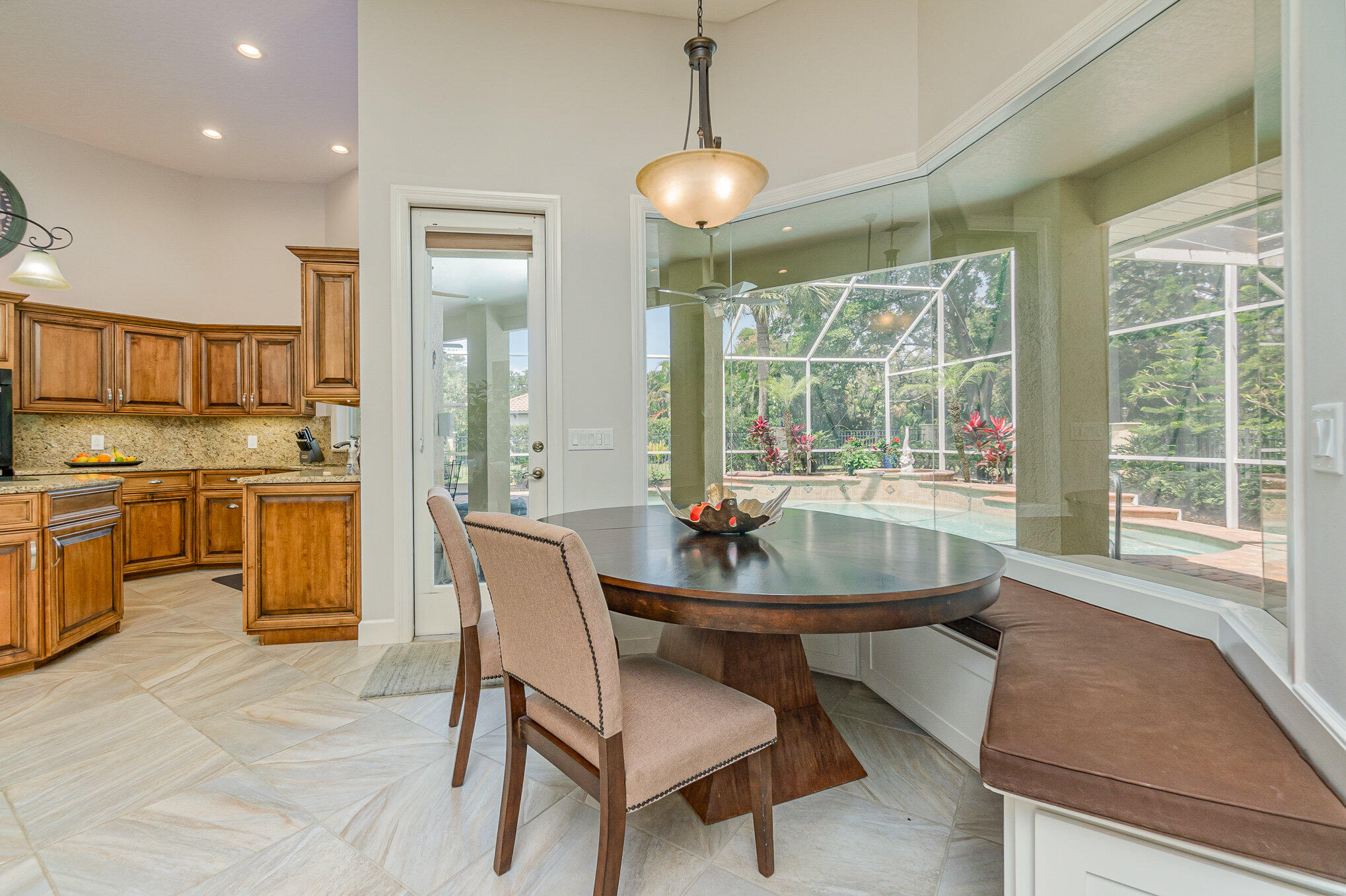 789 Oak Park Drive Melbourne, FL 32940 - Photo 18 of 44 a dining room with furniture and a large window