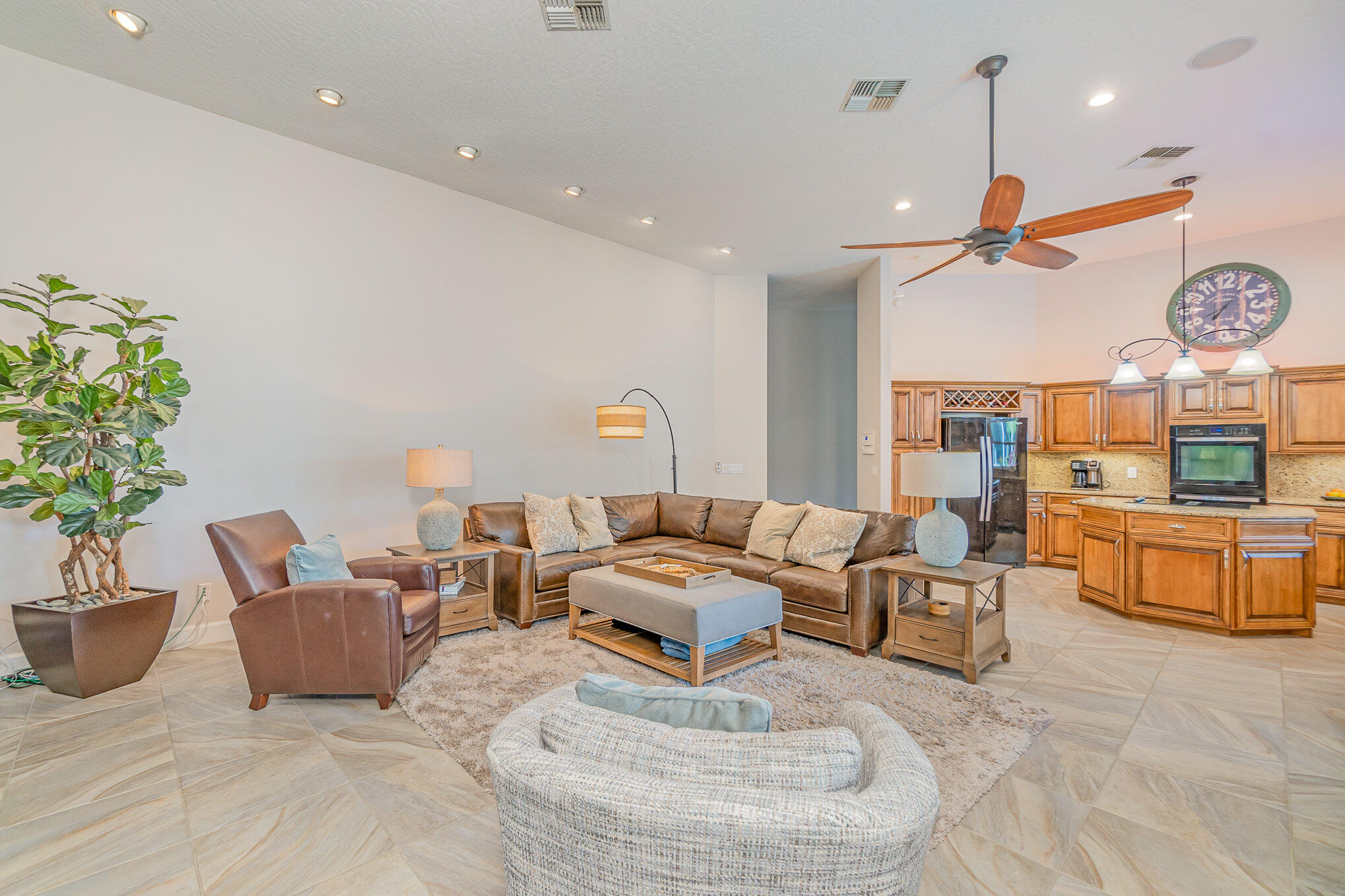 789 Oak Park Drive Melbourne, FL 32940 - Photo 20 of 44 a living room with furniture a window and a chandelier