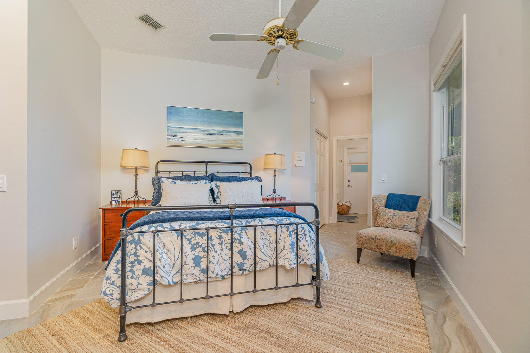 789 Oak Park Drive Melbourne, FL 32940 - Photo 26 of 44 a bedroom with furniture and a chandelier