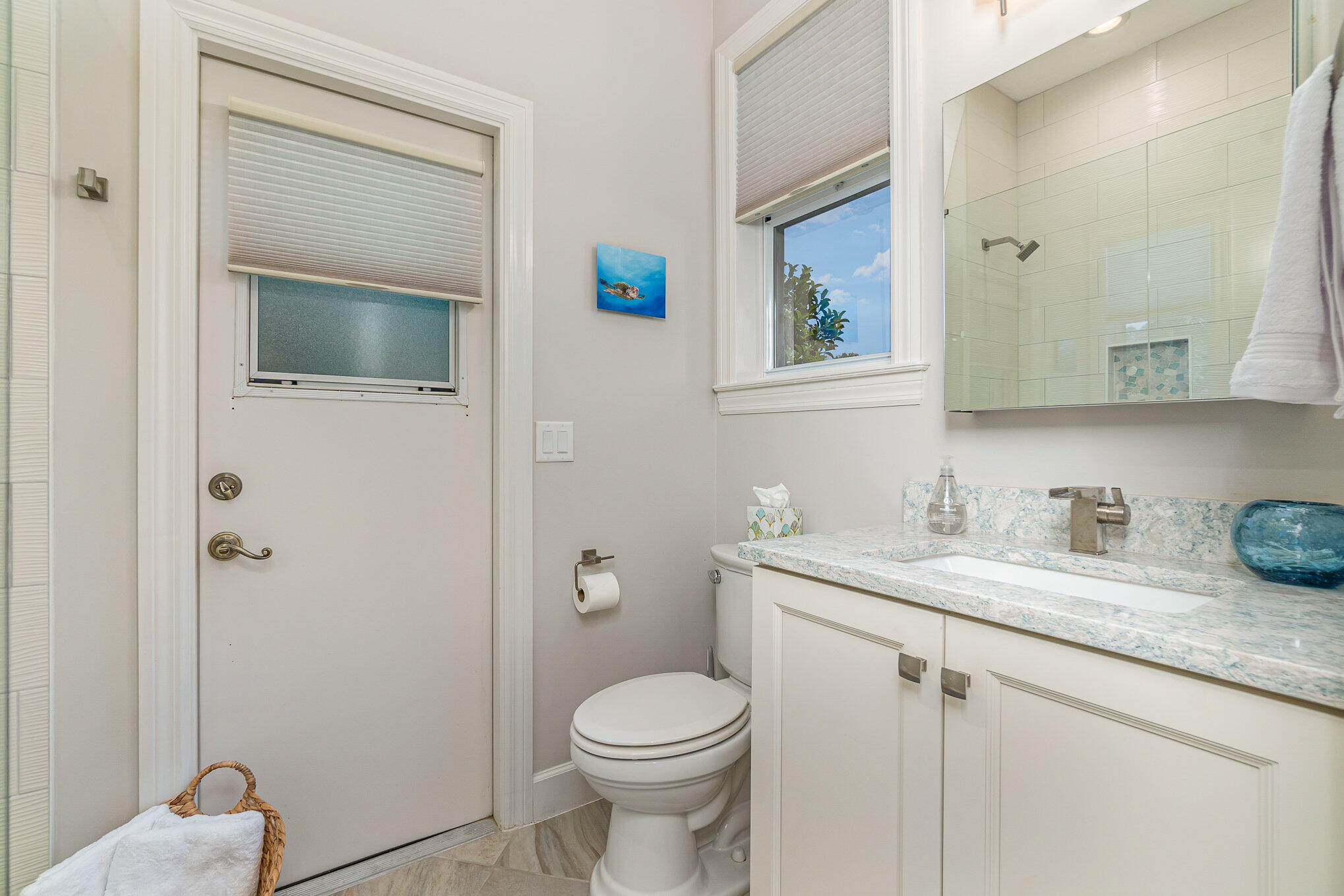 789 Oak Park Drive Melbourne, FL 32940 - Photo 27 of 44 a bathroom with a granite countertop toilet sink and mirror