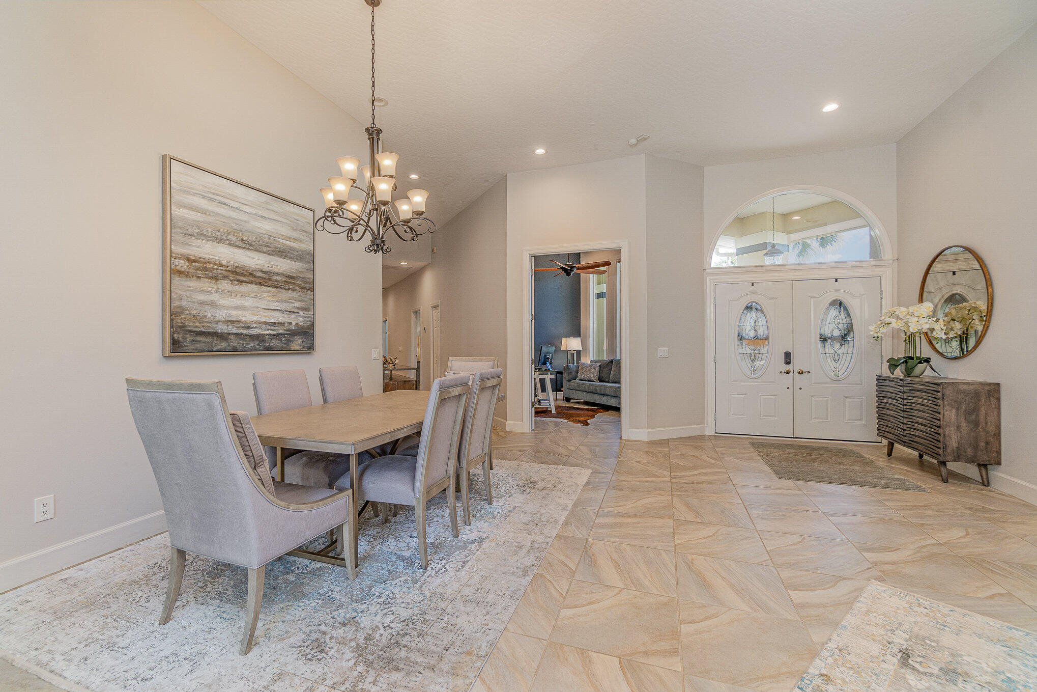 789 Oak Park Drive Melbourne, FL 32940 - Photo 3 of 44 a view of a dining room with furniture and a chandelier