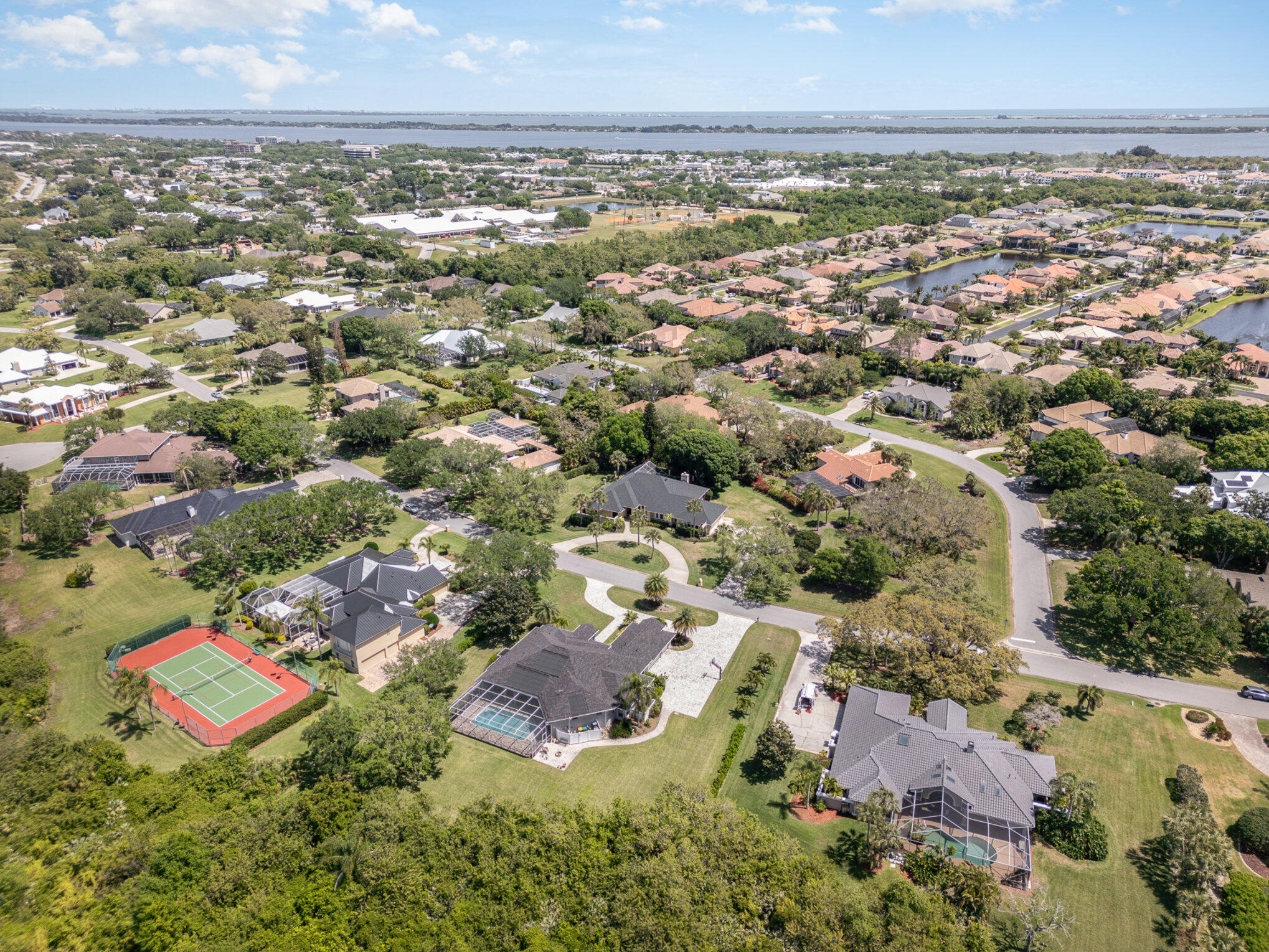 789 Oak Park Drive Melbourne, FL 32940 - Photo 39 of 44 an aerial view of residential houses with outdoor space and trees