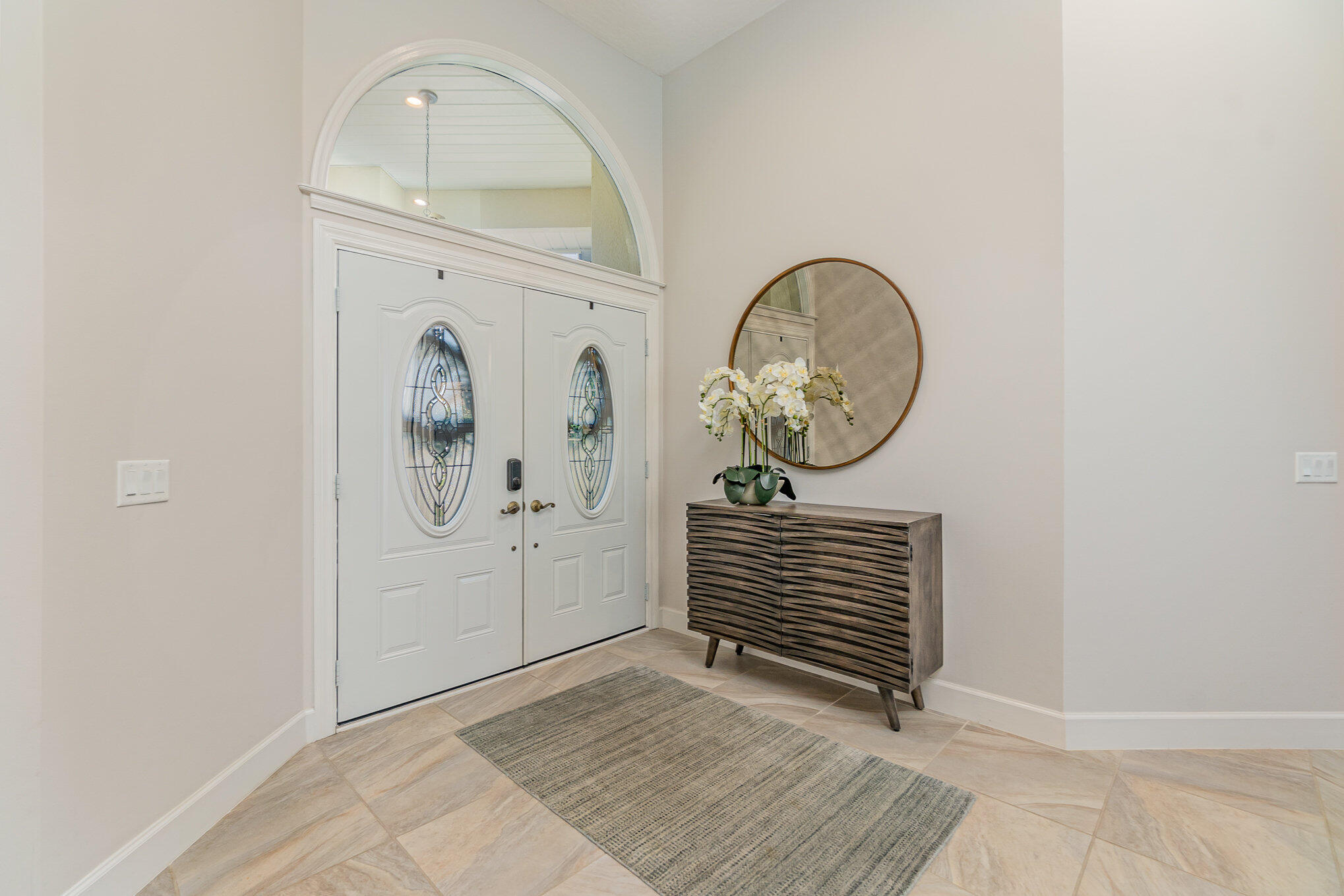 789 Oak Park Drive Melbourne, FL 32940 - Photo 4 of 44 a view of a livingroom with wooden floor and a rug