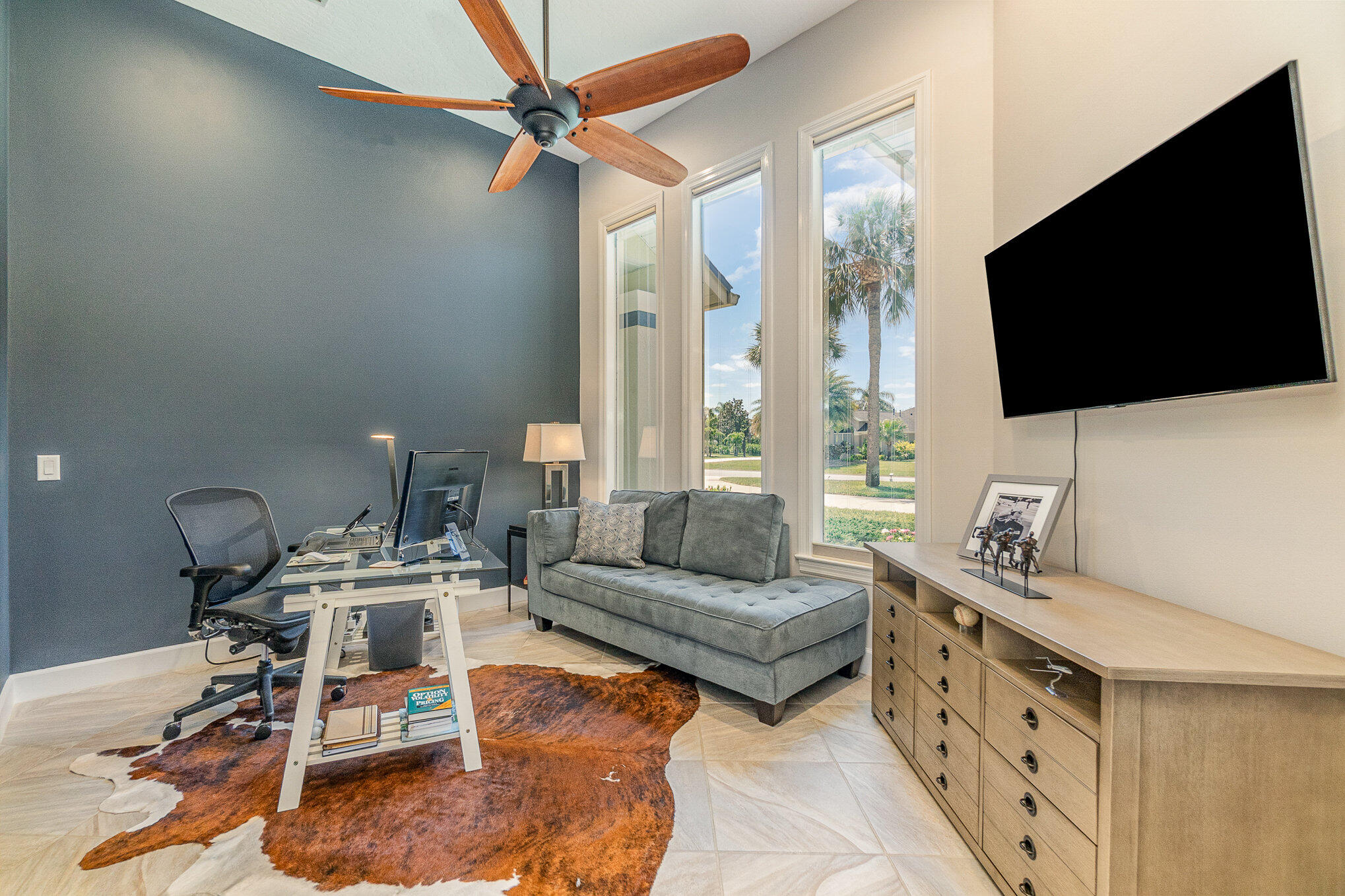 789 Oak Park Drive Melbourne, FL 32940 - Photo 8 of 44 a living room with furniture and a flat screen tv