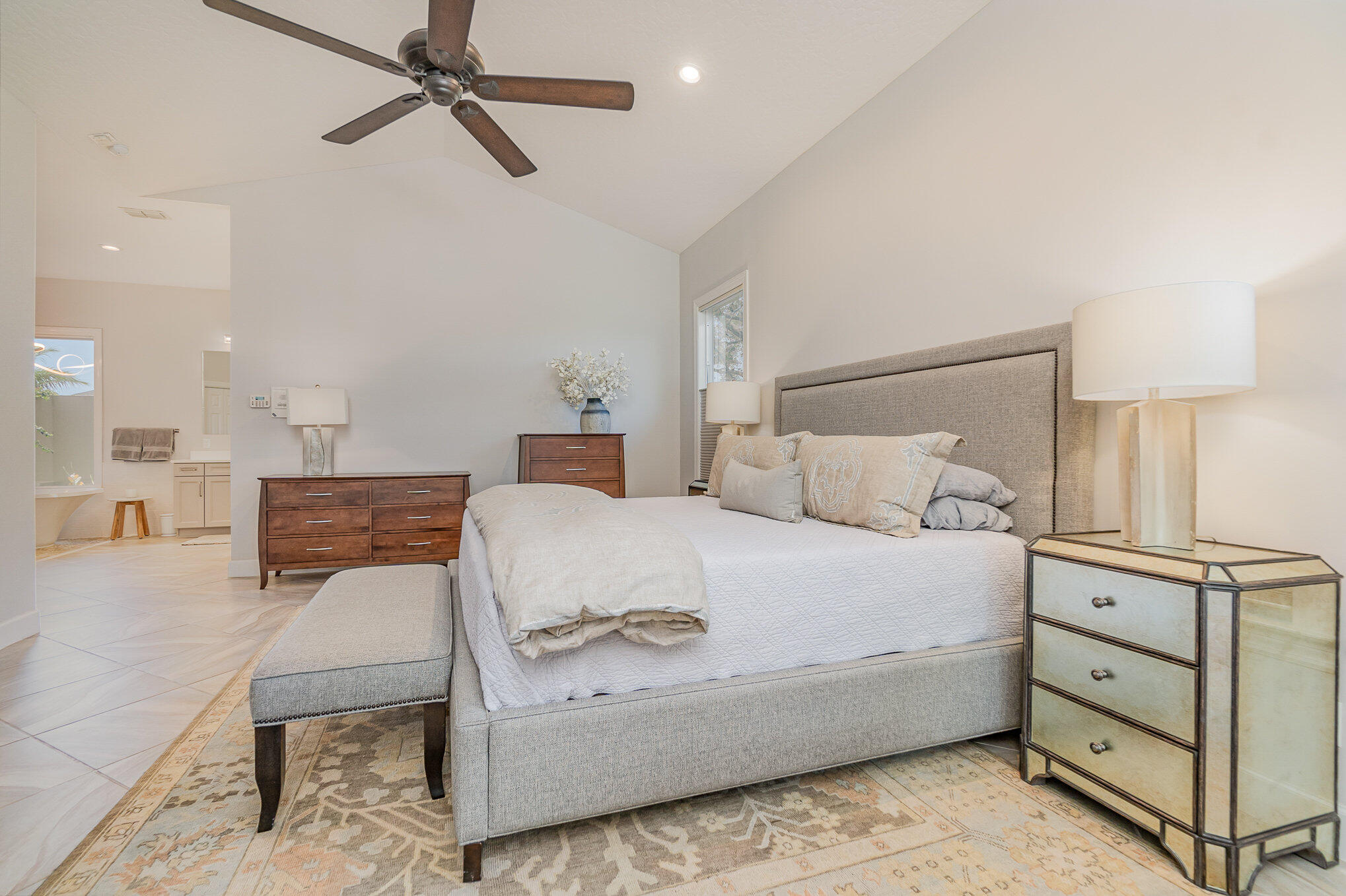 789 Oak Park Drive Melbourne, FL 32940 - Photo 10 of 44 a bedroom with a bed and a lamp on the dresser