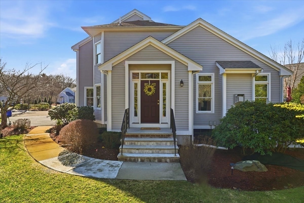 8 Country Circle, Unit 8 Norton, MA 02766 - Photo 1 of 42 a front view of a house with garden