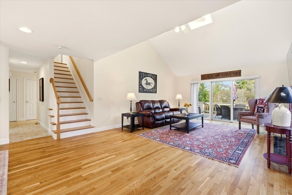 8 Country Circle, Unit 8 Norton, MA 02766 - Photo 12 of 42 a living room with furniture and wooden floor