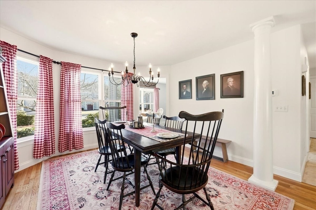 8 Country Circle, Unit 8 Norton, MA 02766 - Photo 13 of 42 a view of a dining room with furniture window and wooden floor