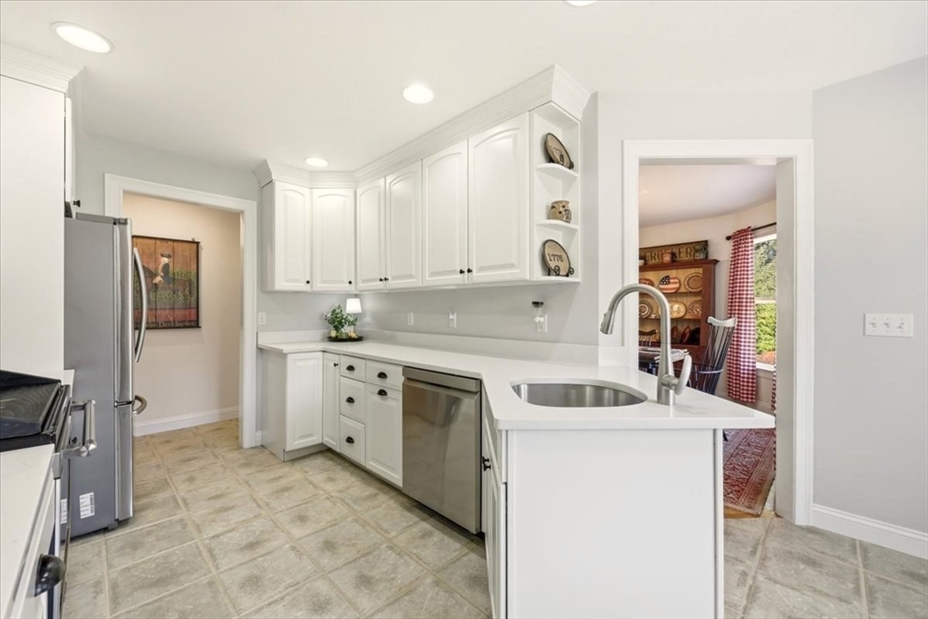 8 Country Circle, Unit 8 Norton, MA 02766 - Photo 15 of 42 a kitchen with cabinets appliances and a counter top space