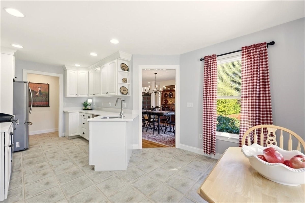 8 Country Circle, Unit 8 Norton, MA 02766 - Photo 16 of 42 a kitchen with a refrigerator and a sink