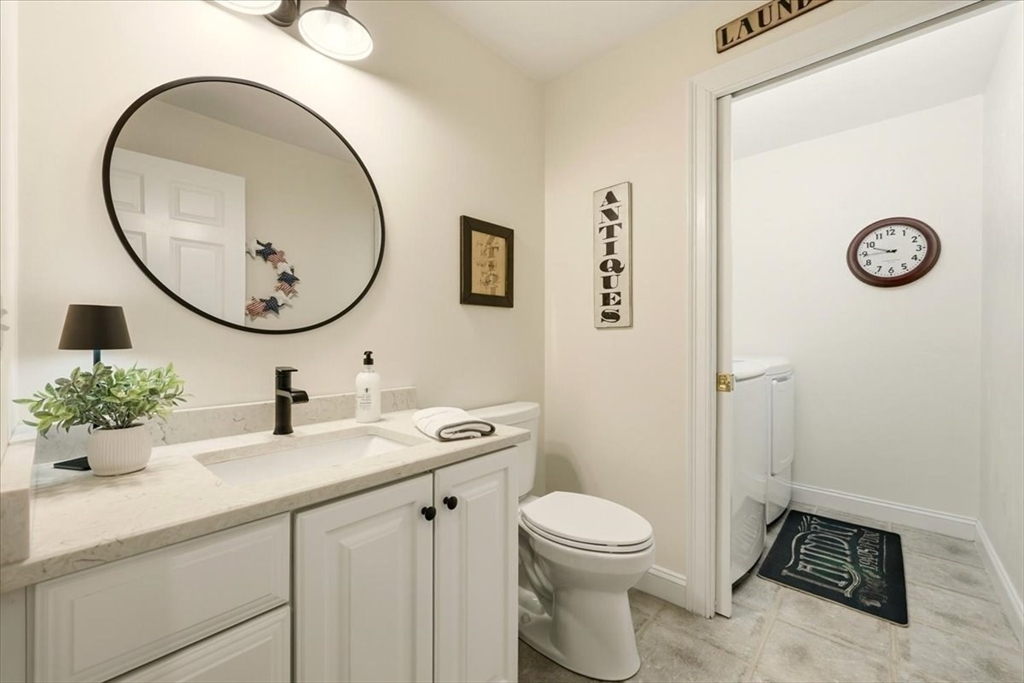 8 Country Circle, Unit 8 Norton, MA 02766 - Photo 18 of 42 a bathroom with a toilet a sink and a mirror