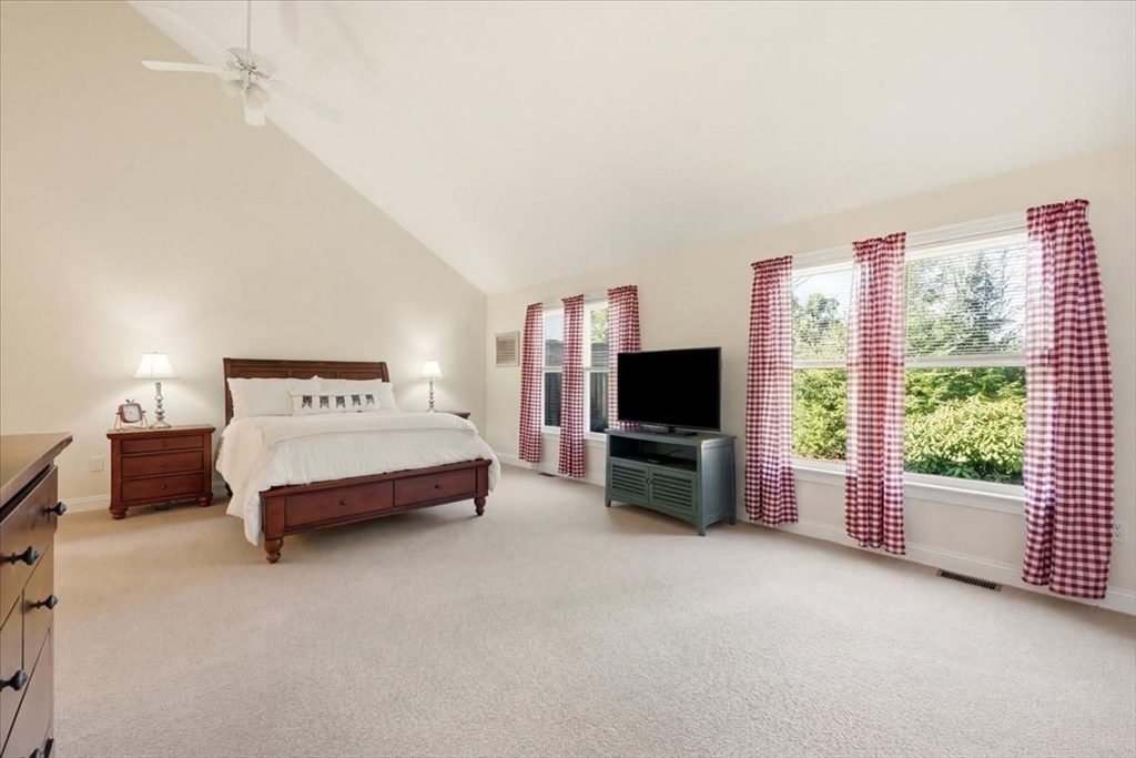 8 Country Circle, Unit 8 Norton, MA 02766 - Photo 19 of 42 a bedroom with a bed and a television