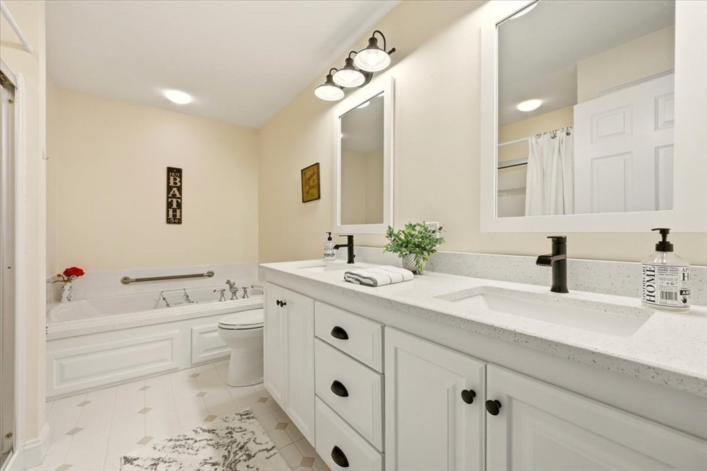 8 Country Circle, Unit 8 Norton, MA 02766 - Photo 21 of 42 a bathroom with a sink vanity granite and a toilet