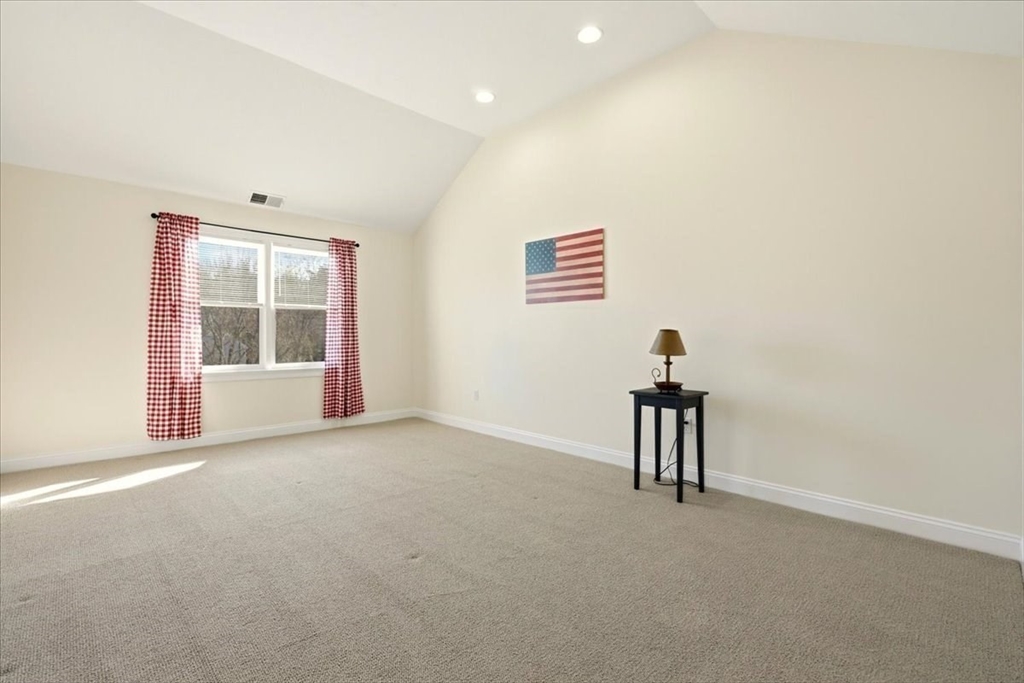 8 Country Circle, Unit 8 Norton, MA 02766 - Photo 25 of 42 a view of an empty room with a window