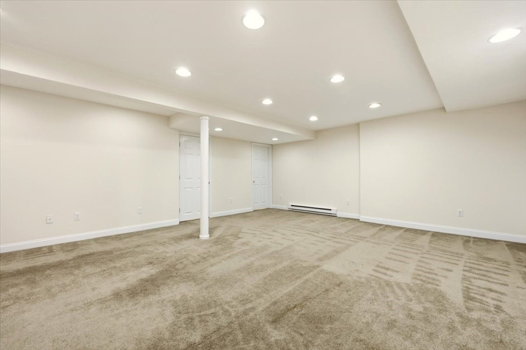 8 Country Circle, Unit 8 Norton, MA 02766 - Photo 32 of 42 an empty room with an entryway