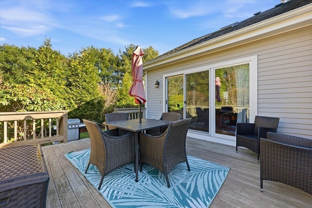 8 Country Circle, Unit 8 Norton, MA 02766 - Photo 39 of 42 a view of a house with patio and wooden floor