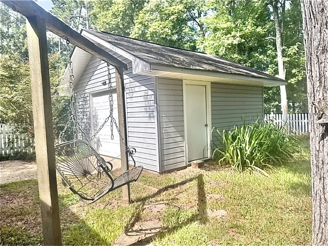 a view of a porch with a bench in patio