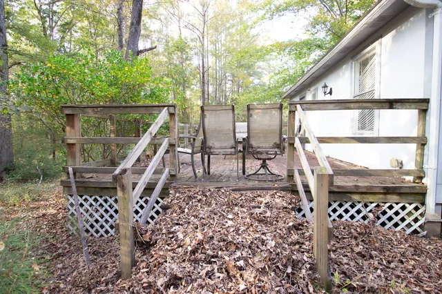 a front view of a house with wooden stairs