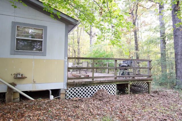 a view of a chairs and table on the deck