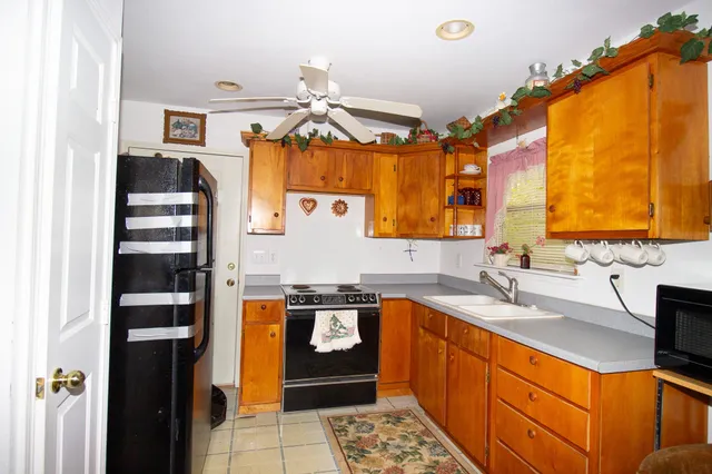 a kitchen with stainless steel appliances granite countertop a sink and cabinets