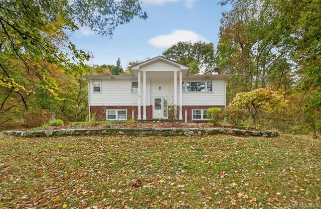 a house with trees in front of it