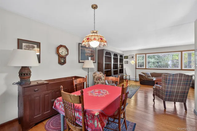a spacious bedroom with a bed and wooden floor
