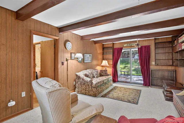a patio with yard glass top table and chairs