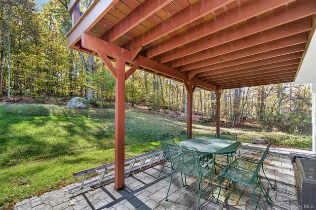 a view of a backyard with a tree