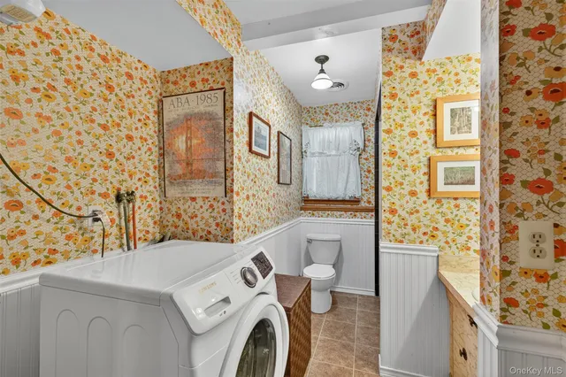 a view of a fire pit with large trees