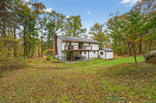 a view of a yard with a tree