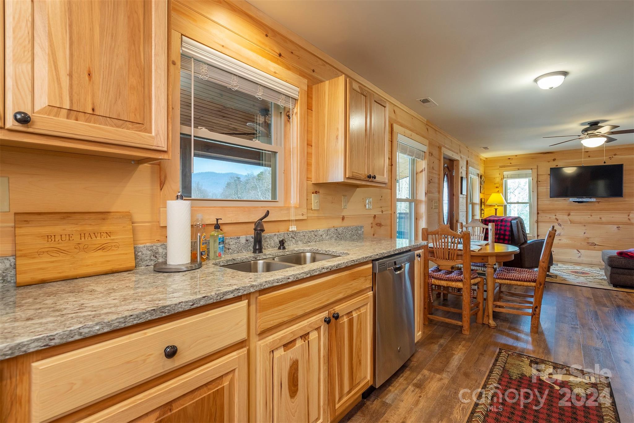 4125 Old Greenlee Road Marion, NC 28752 - Photo 18 of 48 a kitchen with stainless steel appliances granite countertop sink stove and cabinets