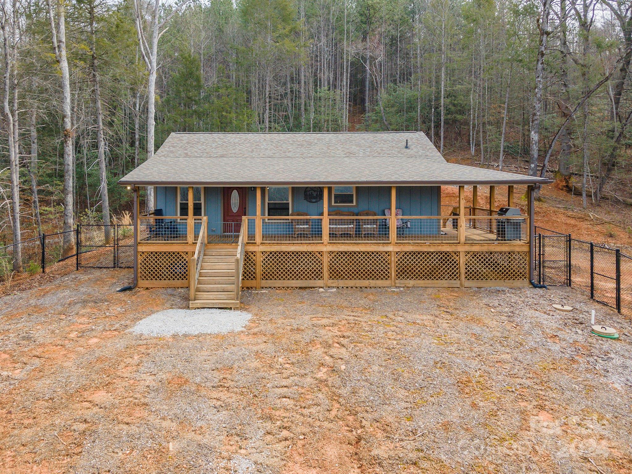 4125 Old Greenlee Road Marion, NC 28752 - Photo 2 of 48 a front view of a house with a yard