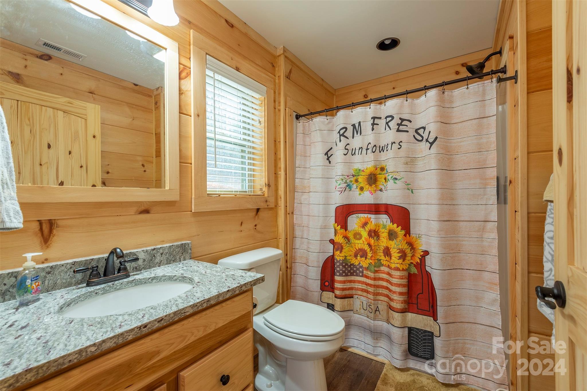 4125 Old Greenlee Road Marion, NC 28752 - Photo 22 of 48 a bathroom with a granite countertop sink toilet and shower