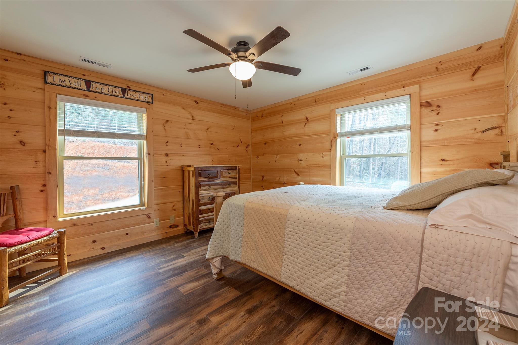 4125 Old Greenlee Road Marion, NC 28752 - Photo 24 of 48 a bed sitting in a bedroom next to a window