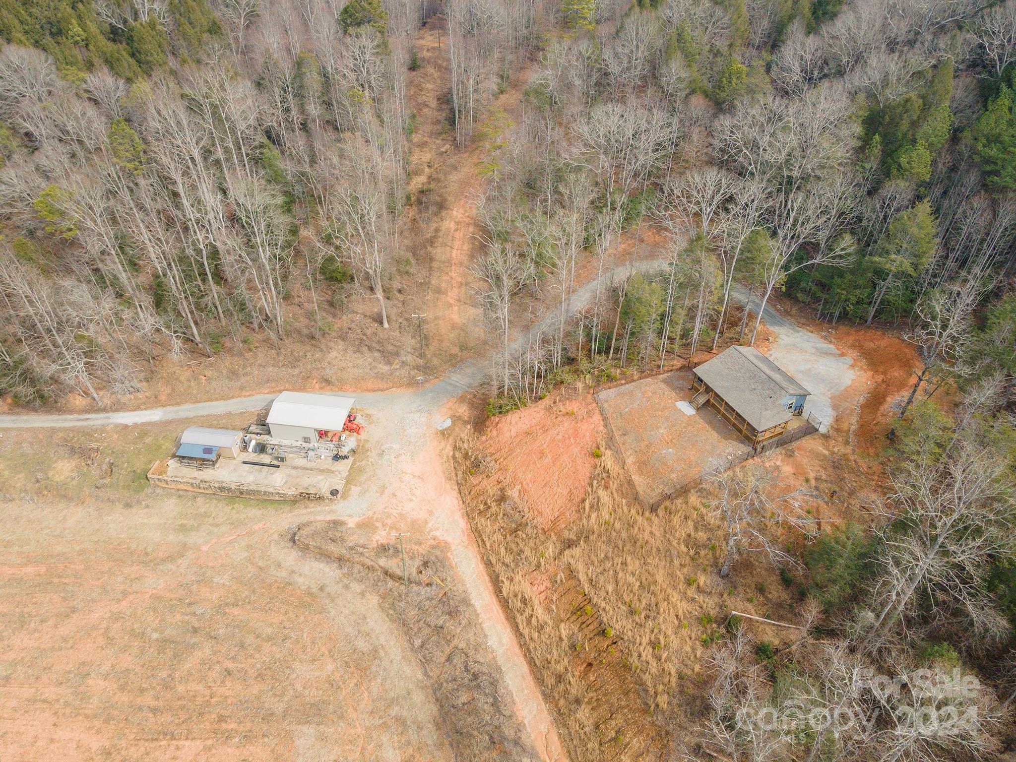 4125 Old Greenlee Road Marion, NC 28752 - Photo 26 of 48 a view of white house with a yard and sitting area