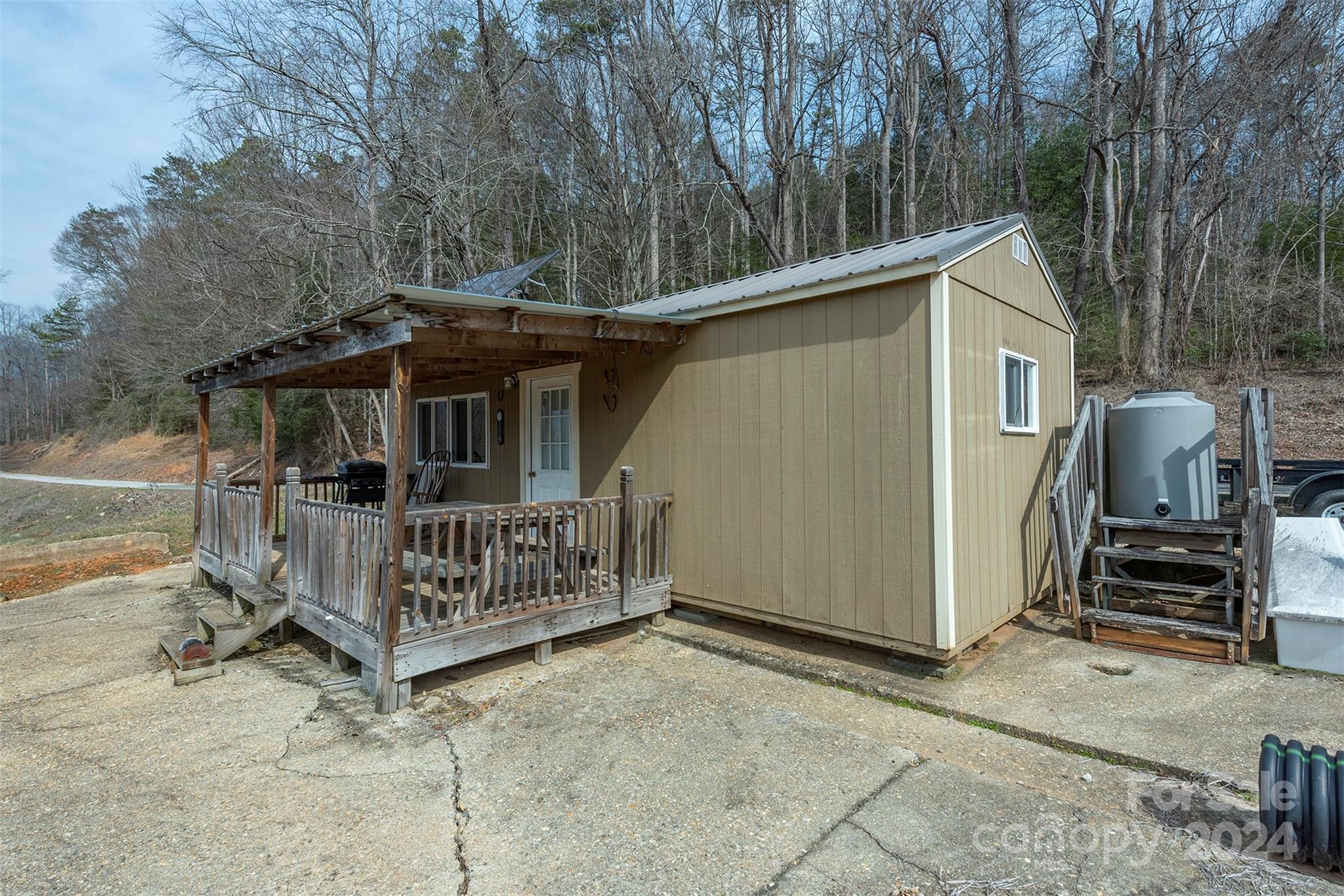 4125 Old Greenlee Road Marion, NC 28752 - Photo 43 of 48 a view of a house with a yard and deck area