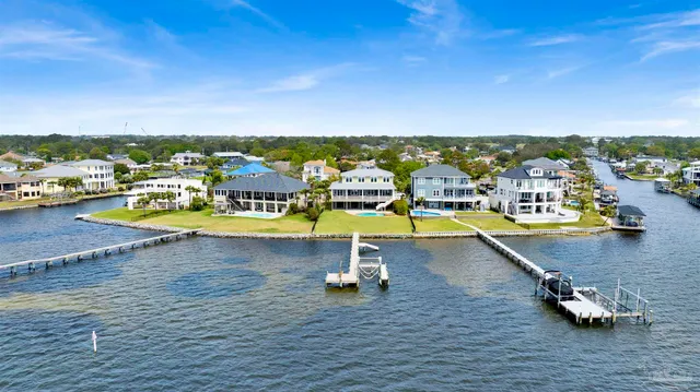 an aerial view of a swimming pool with seating area