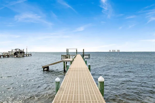 an aerial view of a swimming pool with seating area
