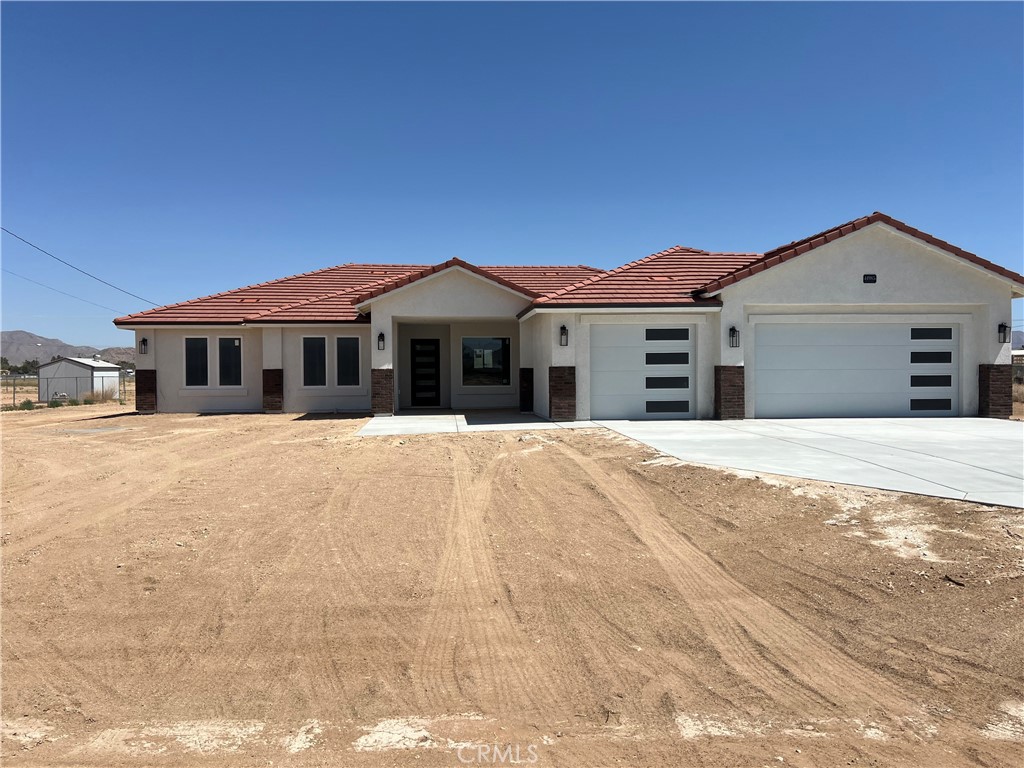 14985 Gayhead Road Apple Valley, CA 92307 - Photo 1 of 1 a front view of a house with a yard