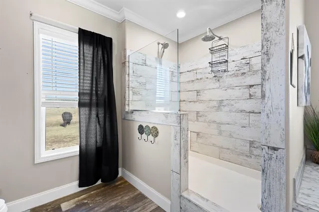 a bathroom with a shower and a sink