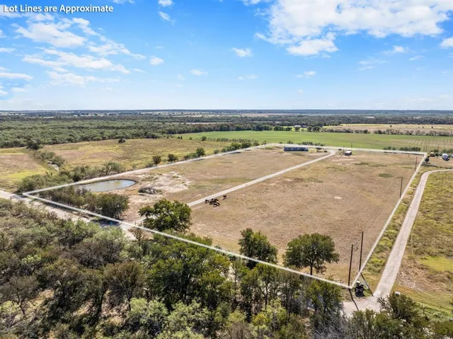 a view of a big room with an ocean and trees
