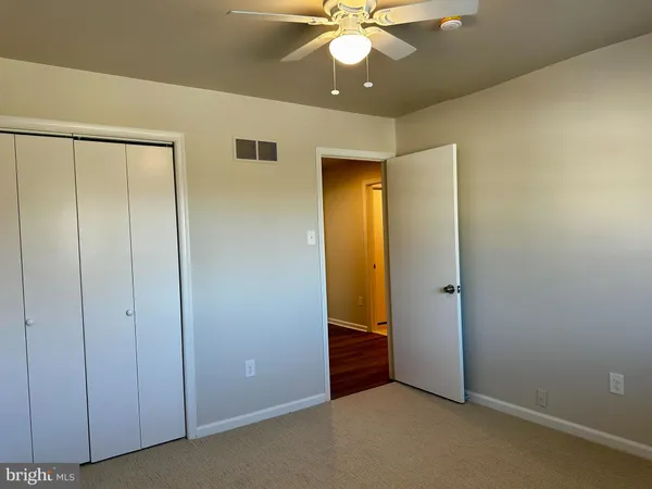 a bathroom with a bathtub and a toilet