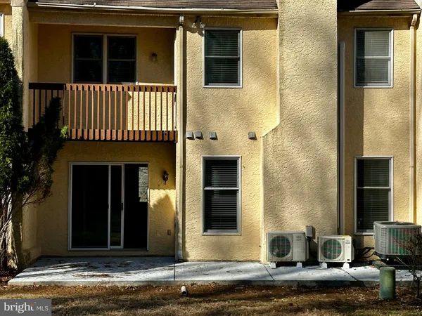 a view of a yard with large trees