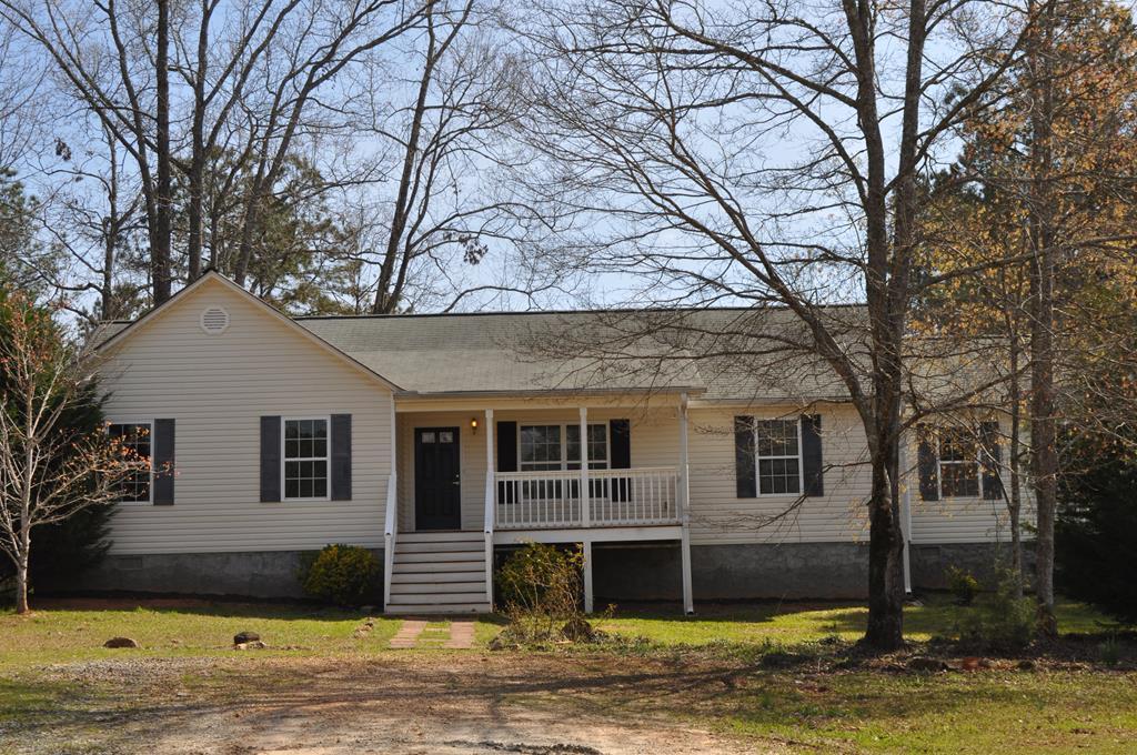142 Old Indian Springs Road Forsyth, GA 31029 - Photo 1 of 30 a front view of a house with a yard