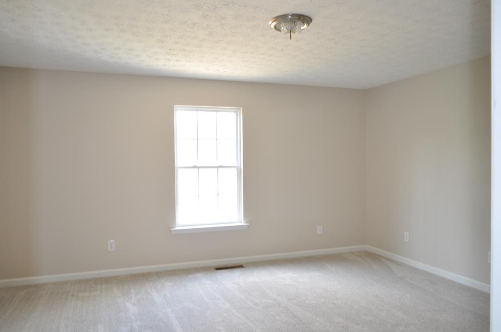 142 Old Indian Springs Road Forsyth, GA 31029 - Photo 11 of 30 an empty room with a window