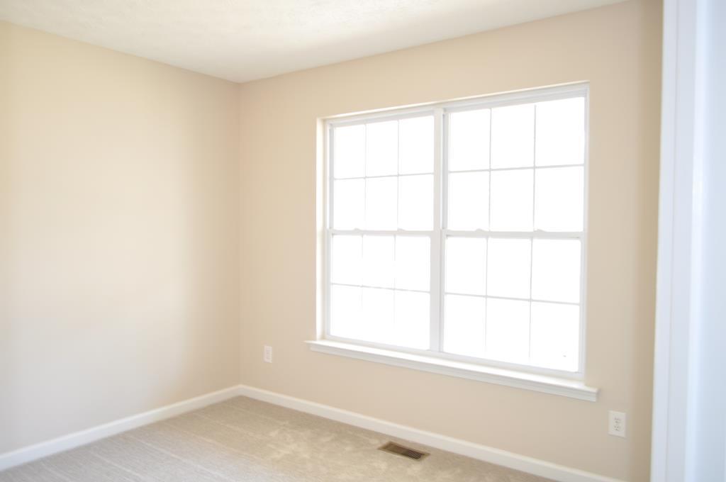 142 Old Indian Springs Road Forsyth, GA 31029 - Photo 14 of 30 an empty room with a window