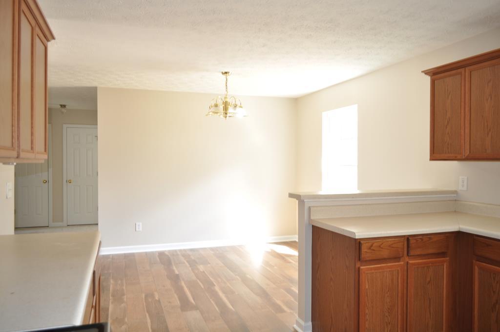 142 Old Indian Springs Road Forsyth, GA 31029 - Photo 15 of 30 a view of a kitchen cabinets and a wooden floor