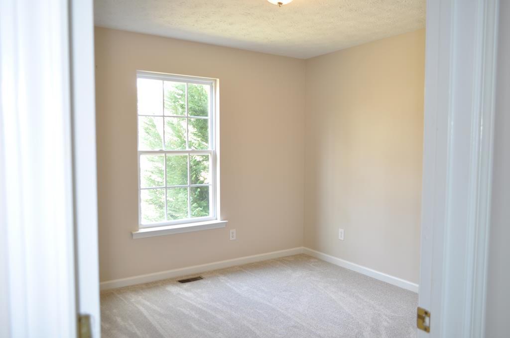 142 Old Indian Springs Road Forsyth, GA 31029 - Photo 16 of 30 an empty room with a window