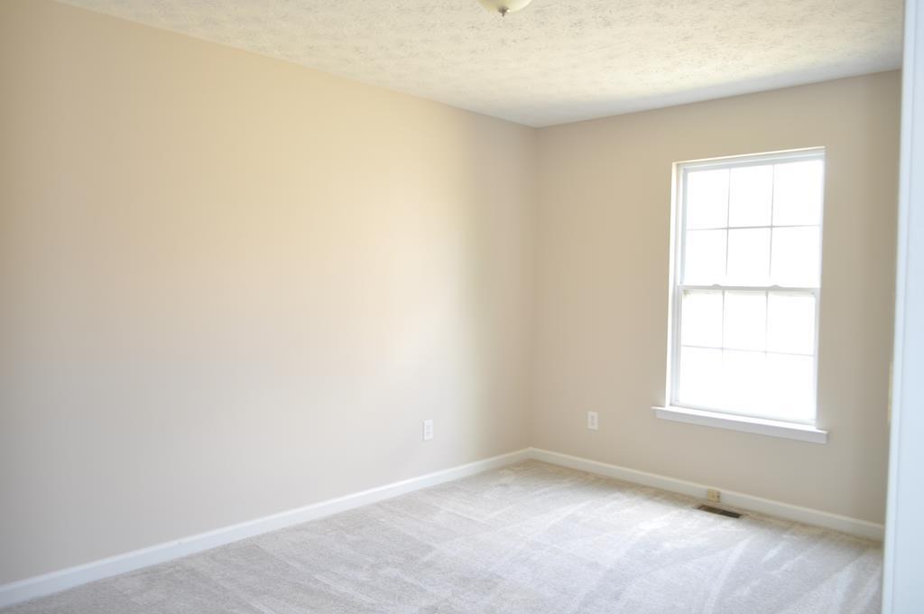 142 Old Indian Springs Road Forsyth, GA 31029 - Photo 17 of 30 an empty room with a window