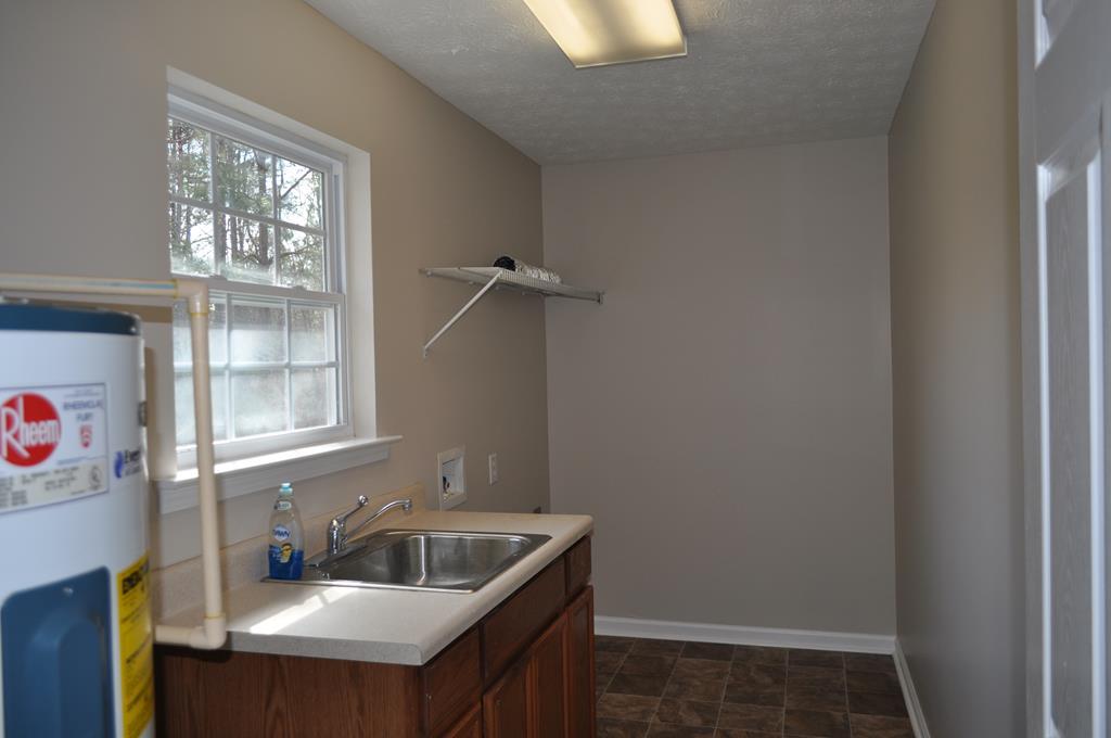142 Old Indian Springs Road Forsyth, GA 31029 - Photo 22 of 30 a bathroom with a sink and a window
